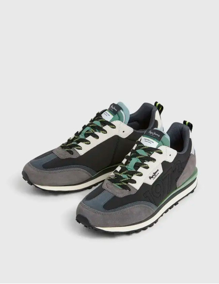 Zapatillas de running grises con detalles verdes