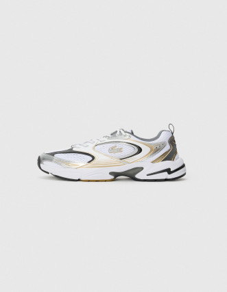 Zapatilla de running Nike dorada y blanca