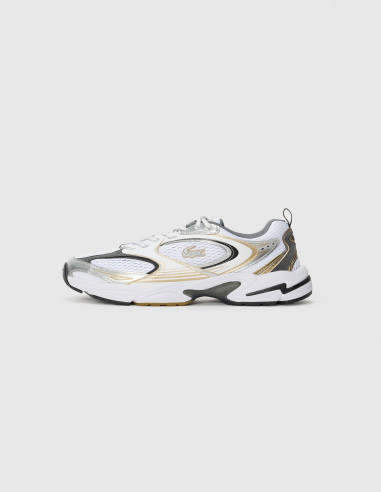 Zapatilla de running Nike dorada y blanca