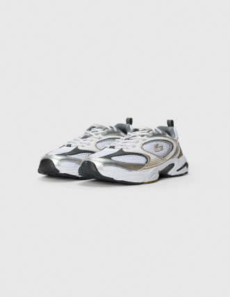 Zapatilla de running Nike dorada y blanca 2